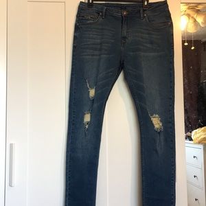 Distressed denim pants